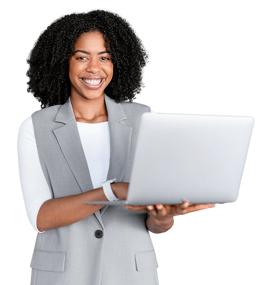 A smiling woman in a blazer holding an open laptop